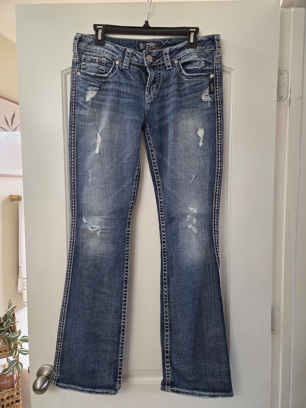 Silver Jeans Distressed Blue Flare Jeans